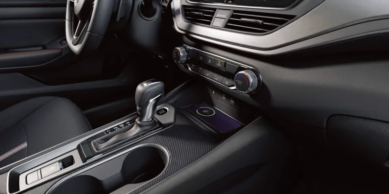 Close up on a phone wirelessly charging in the 2027 Nissan Altima sedan at Nissan of Dearborn in Dearborn MI
